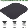A dark gray mat is shown above three images of Thermomix kitchen appliances, labeled TM6, TM5, and TM31. Produktbild-Vorschau