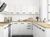 A clean, modern white kitchen with wooden countertops and black hardware. Produktbild-Vorschau