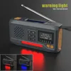 A digital radio with a solar panel and hand crank, shown with warning lights and a small inset showing different light colors. Produktbild-Vorschau