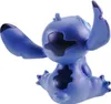 A blue Stitch figurine is shown from the back, sitting with its arms outstretched. Produktbild-Vorschau