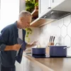 An older man is cooking in a modern kitchen. Anteprima dell’immagine prodotto
