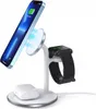 A white 3-in-1 wireless charging stand with a smartphone, smartwatch, and earbuds case on it. Produktbild-Vorschau