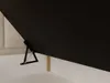 A close-up view of a bed frame mechanism and a portion of the mattress and headboard. Produktbild-Vorschau