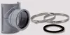 A plumbing fitting and two metal clamps are arranged on a light gray background. Náhľad obrázku produktu