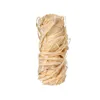 A single fire starter made of wood shavings, tied together with string. Podgląd zdjęcia produktu