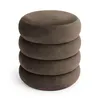 A stack of four round, upholstered ottomans. Produktbild-Vorschau