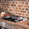 A kitchen counter with a stovetop and various cooking ingredients. Náhled obrázku produktu