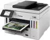A Canon MAXIFY/GX7140 printer is shown from a slightly elevated front-left angle, with a document partially ejected from the paper tray. Produktbild-Vorschau