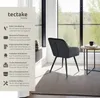 A chair in a modern room setting with a window view. Náhled obrázku produktu