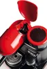 A close-up view of a red and black espresso machine. Produktbild-Vorschau