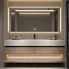 A modern bathroom vanity with a sink, mirror, and storage.