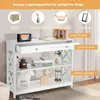 A white console table with drawers and shelves, decorated with various items. Náhľad obrázku produktu