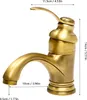 A close-up studio shot of a brass-colored bathroom faucet with dimensions indicated by text overlays. Podgląd zdjęcia produktu
