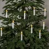 A close-up view of white LED candle lights attached to a green Christmas tree. Podgląd zdjęcia produktu