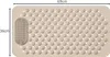 A beige anti-slip bath mat with suction cups and raised nubs for foot massage is shown from a top-down perspective. Dimensions are indicated with arrows and text. Voir les images du produit