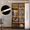 A modern display cabinet with glass doors and LED lighting, showcasing various items inside. Produktbild-Vorschau