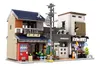 A detailed Lego-style model of a Japanese tea shop and adjacent buildings, set against a white background. Produktbild-Vorschau