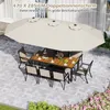 An outdoor dining set with a large double umbrella, set on a paved patio with some greenery. Náhled obrázku produktu