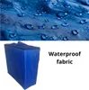A blue storage bag with a close-up of waterproof fabric with water droplets. Náhled obrázku produktu