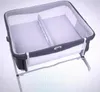 A co-sleeping bassinet for twins, divided into two sections. Produktbild-Vorschau