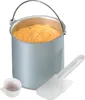 An ice cream maker bucket filled with orange ice cream, with a spatula and a measuring cup next to it. Voir les images du produit