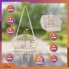 A diagram showing the dimensions of a hanging chair and its cushion, with a blurred outdoor background. Voir les images du produit