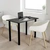 A small black table with two white chairs in a room with a window. Náhled obrázku produktu