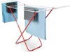 A red and white clothes drying rack with several towels draped over it. Voir les images du produit