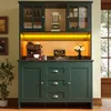 A kitchen hutch with a coffee maker, blender, and decorative items. Náhľad obrázku produktu
