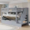 A grey bunk bed with storage and stairs, set up in a child's bedroom. Voir les images du produit