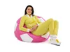 A woman is sitting on a beanbag chair. Produktbild-Vorschau