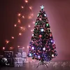 A decorated artificial Christmas tree with lights and ornaments, surrounded by gift boxes and a string of lights on the wall. Voir les images du produit