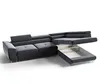 A dark gray sectional sofa with its storage compartment open, shown against a white background. Produktbild-Vorschau