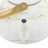 A close-up view of a white kettle with gold marbling and a gold handle. Podgląd zdjęcia produktu