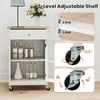 A white kitchen cart with a wooden top, shown with bottles and jars on its shelves. The image includes diagrams highlighting adjustable shelf levels and caster wheel functionality. Podgląd zdjęcia produktu