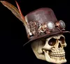 A steampunk-themed skull wearing a hat, decorated with gears and feathers, against a black background. Produktbild-Vorschau