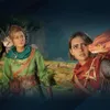 Two women with small dragon-like creatures on their shoulders in a forest setting. Podgląd zdjęcia produktu