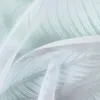 A close-up view of a white sheer fabric with a subtle green pattern, likely a curtain or blind. Produktbild-Vorschau