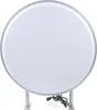 A round, double-sided LED lightbox sign with a silver frame and a white illuminated surface, mounted on two silver brackets. A black power cord is visible at the bottom. Náhled obrázku produktu