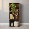 A set of wooden crates stacked vertically, used as shelving, with decorative items. Anteprima dell’immagine prodotto