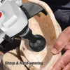A person is using a power tool with a spherical grinding attachment to carve a wooden bowl. Produktbild-Vorschau