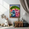 A framed painting of Stitch and Angel sitting under a leaf is displayed on a wall in a room. Decorative items are placed on the floor and a bench below the painting. Náhled obrázku produktu