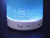 Close-up of the bottom part of a blue cracked light Bluetooth speaker. Produktbild-Vorschau