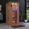 An infrared sauna in a modern bathroom setting with a window view of greenery. Produktbild-Vorschau