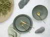 A flat lay of a table setting with plates, cutlery, and decorative elements. Náhľad obrázku produktu