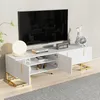 A white TV stand with gold accents is shown in a living room setting, with a large TV mounted on the wall behind it. Produktbild-Vorschau