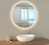 A modern bathroom vanity with a round LED mirror, a vessel sink, and a faucet. Produktbild-Vorschau