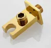 A close-up studio shot of a gold-colored shower arm bracket. Podgląd zdjęcia produktu