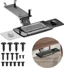 A black under-desk keyboard tray with a keyboard and mouse on it, shown from a slightly elevated angle. Several screws are displayed in the lower left corner. A circular inset shows the tray installed under a wooden desk. Voir les images du produit