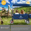 Two children are sitting in a blue wagon pulled by someone, with alpacas in the background. Produktbild-Vorschau